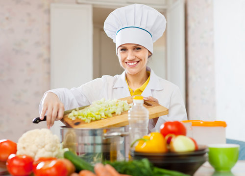 cook woman cooking vegetarian dinner