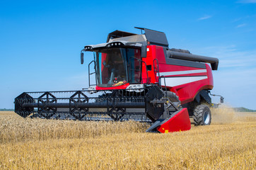 Combine in the field during grain cleaning