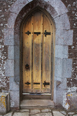 old tudor wooden oak door wih latches and locks