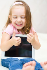 little girl with tablet computer