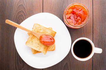 Breakfast with tea, toast and apricot jam