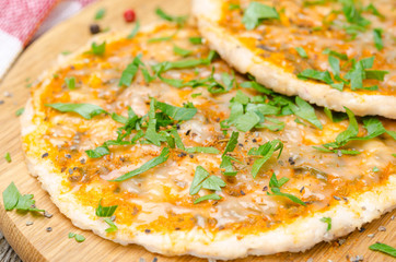 chicken pizza with tomato sauce, cheese and greens