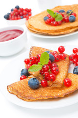 crepes with fresh berries and jam for breakfast