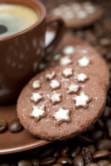 cup of black coffee and Christmas cookies close-up