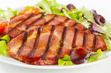 Grilled pork with salad greens