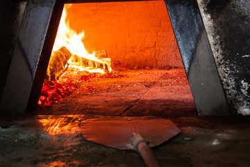 Sicilian wood stove firebox and pizza peel