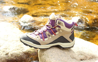 Hiking boot over a mountain stream