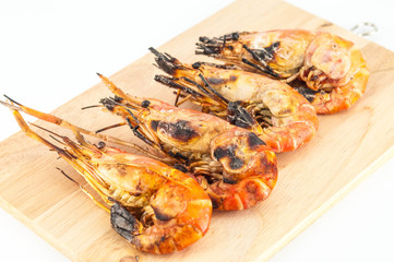 grilled prawns on wood white isolate