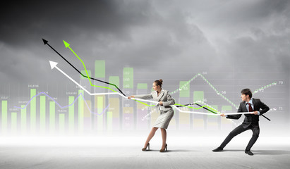 Businesspeople pulling graph