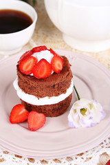 Chocolate cake with strawberry on table close-up