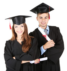 Two happy graduating students isolated on white