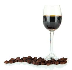 Glass of liquor and coffee grains, isolated on white