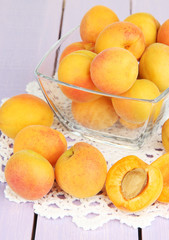 Fresh natural apricot in bowl on wooden table