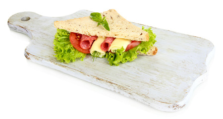 Tasty sandwich with salami sausage and vegetables