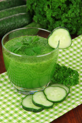 Green vegetable juice on table close-up
