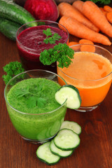 Fresh vegetable juices on table close-up