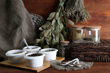 Assortment of spices in  white spoons and bowls,