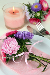Festive dining table setting with flowers