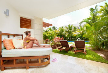 Relaxing woman at caribbean resort.