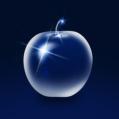 Glass apple on blue background