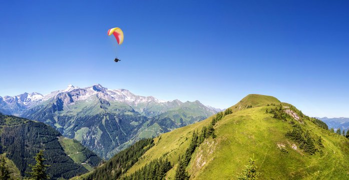 Mountain panorama with paraglider