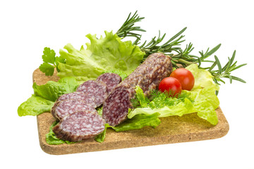 Salami with rosemary, salad and tomatoes