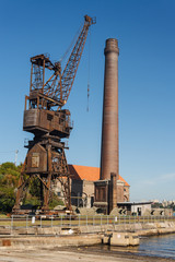 rusty crane with chimney on Cockatoo Island