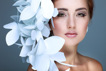 Wonderful girl in a hat from paper white butterflies