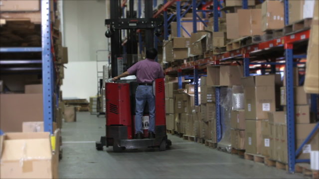 Time Lapse Sequence Fork Lift In Warehouse