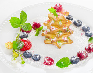 Christmas dessert -  tree of chookies with berries and mint