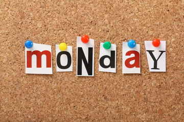 The word Monday on a cork notice board