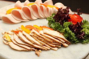 Cold cut slices on  board