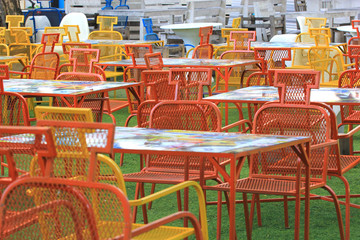 red and yellow dinning table set in the garden