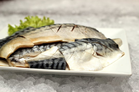 saba fish on a white plate