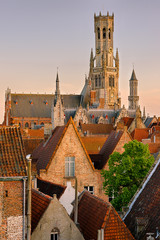 Sunset in Bruges. View on the city and Belfry from the roof.