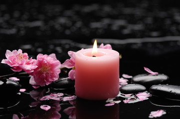 Obraz na płótnie Canvas blossoming cherry with candle -Spa series