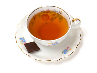 tea in vintage cup isolated on white