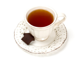 tea in vintage cup isolated on white