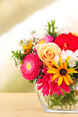 Obraz na płótnie Canvas Beautiful bouquet of bright flowers in glass vase,