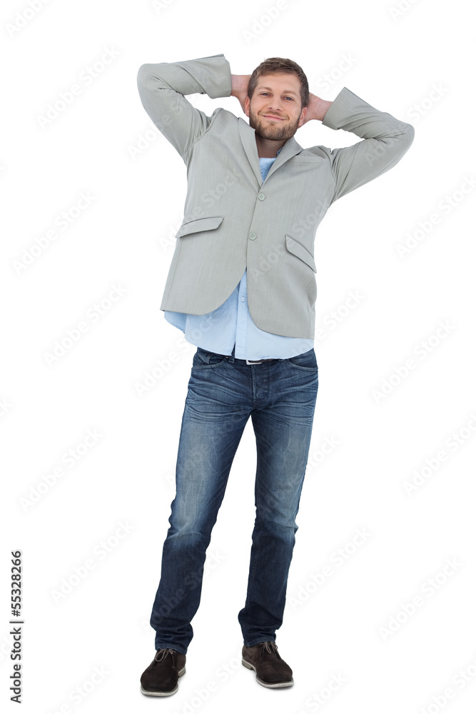 Poster suave man in a blazer with hands behind head looking at camera