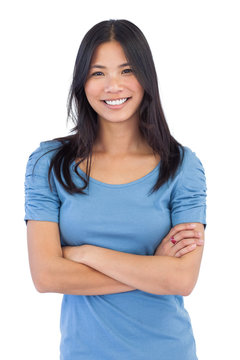 Smiling asian woman with arms crossed