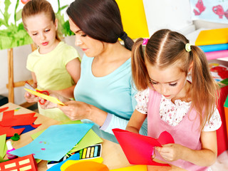 Child cutting out scissors paper.