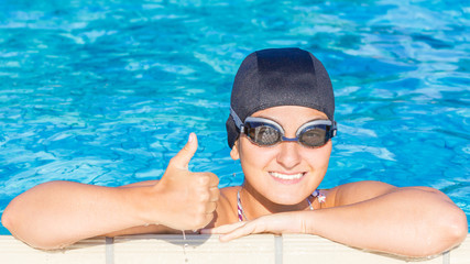 Female swimmer, thumb up