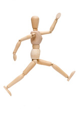 Figur aus Holz im Sprung