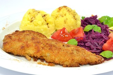 pollock fried with potatoes and vegetables