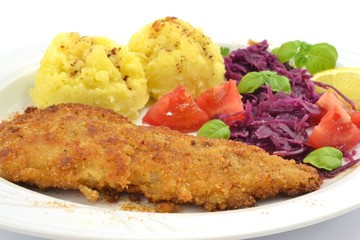 pollock fried with potatoes and vegetables