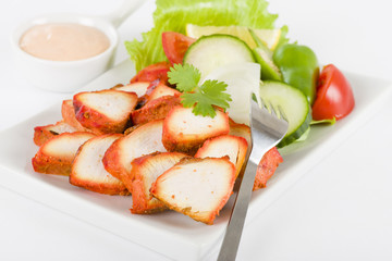 Chicken Tikka - Spicy marinated chicken with salad and dip.