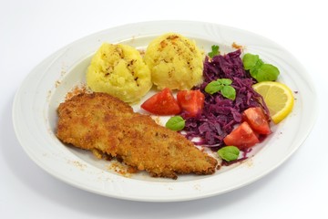 pollock fried with potatoes and vegetables