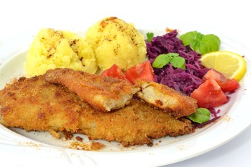 pollock fried with potatoes and vegetables