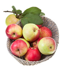 basket with red and yellow apples isolated